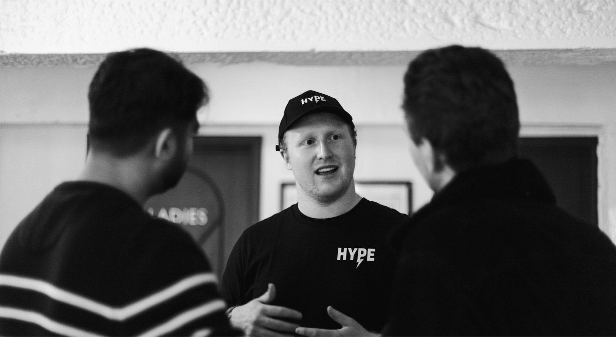 John, founder of HYPE, talking with guests at an event